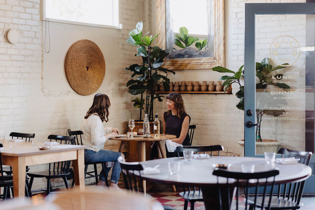 Guide to the Most Luxurious Getaway, Diners eating at Bell's in Los Alamos, California, a Michelin starred restaurant in the Santa Ynez Valley