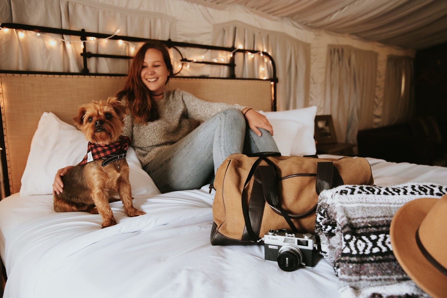 Glamping tent with woman and dog at Flying Flags RV Resort in Buellton