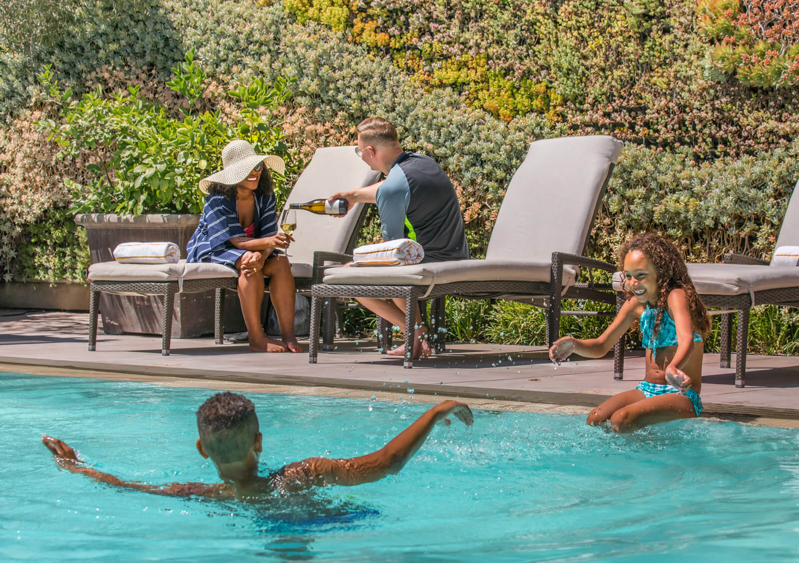 Family at the pool at the Fess Parker Inn