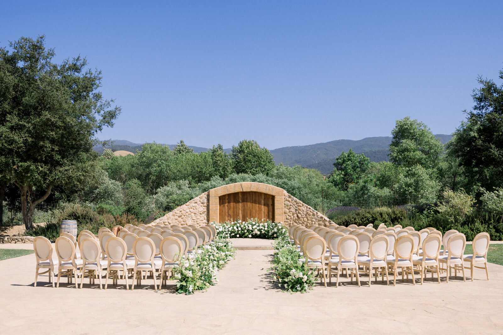 Outdoor wedding chairs set for ceremony