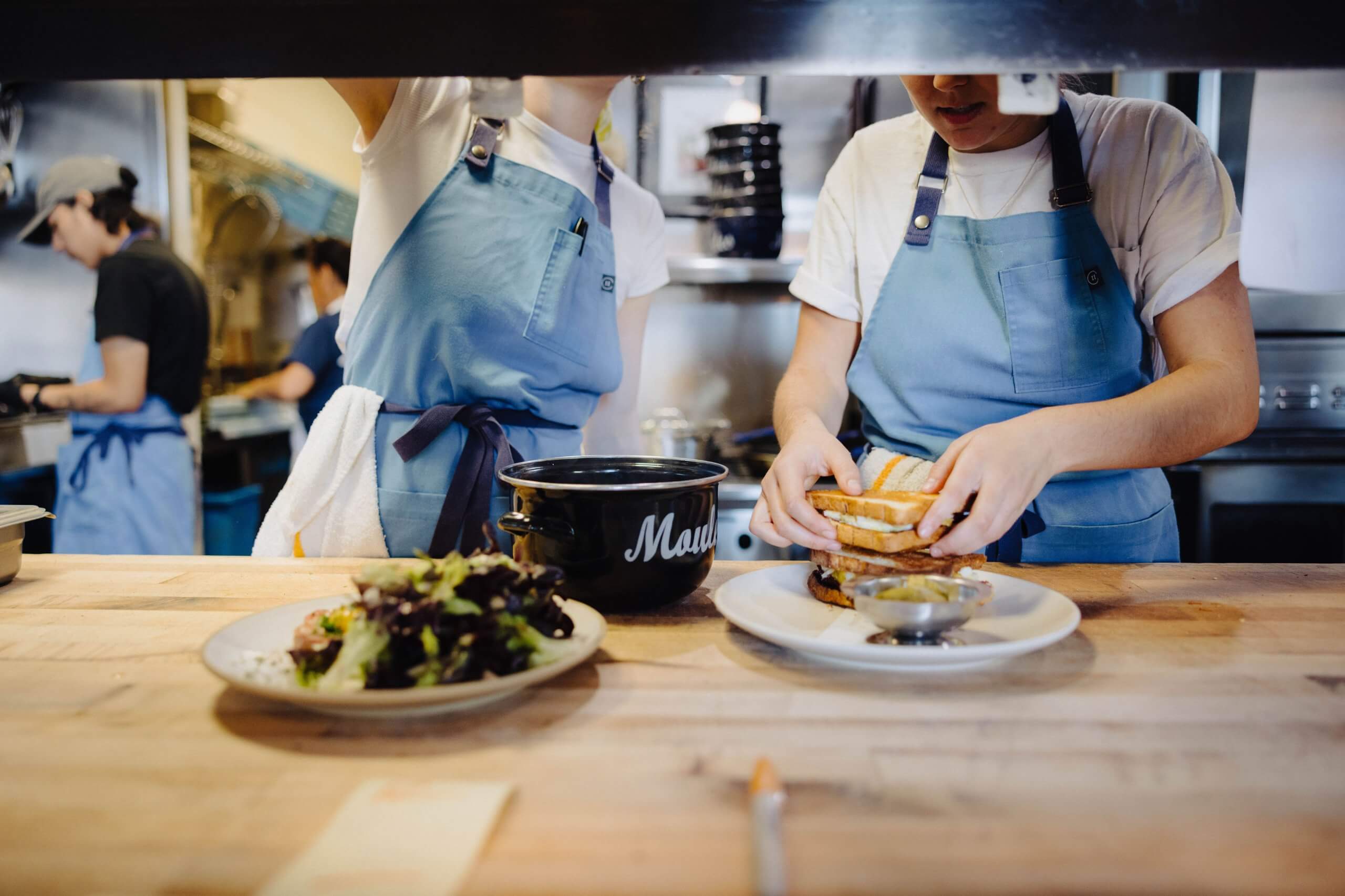 Santa Ynez Valley Restaurants cooks preparing plates at a counter