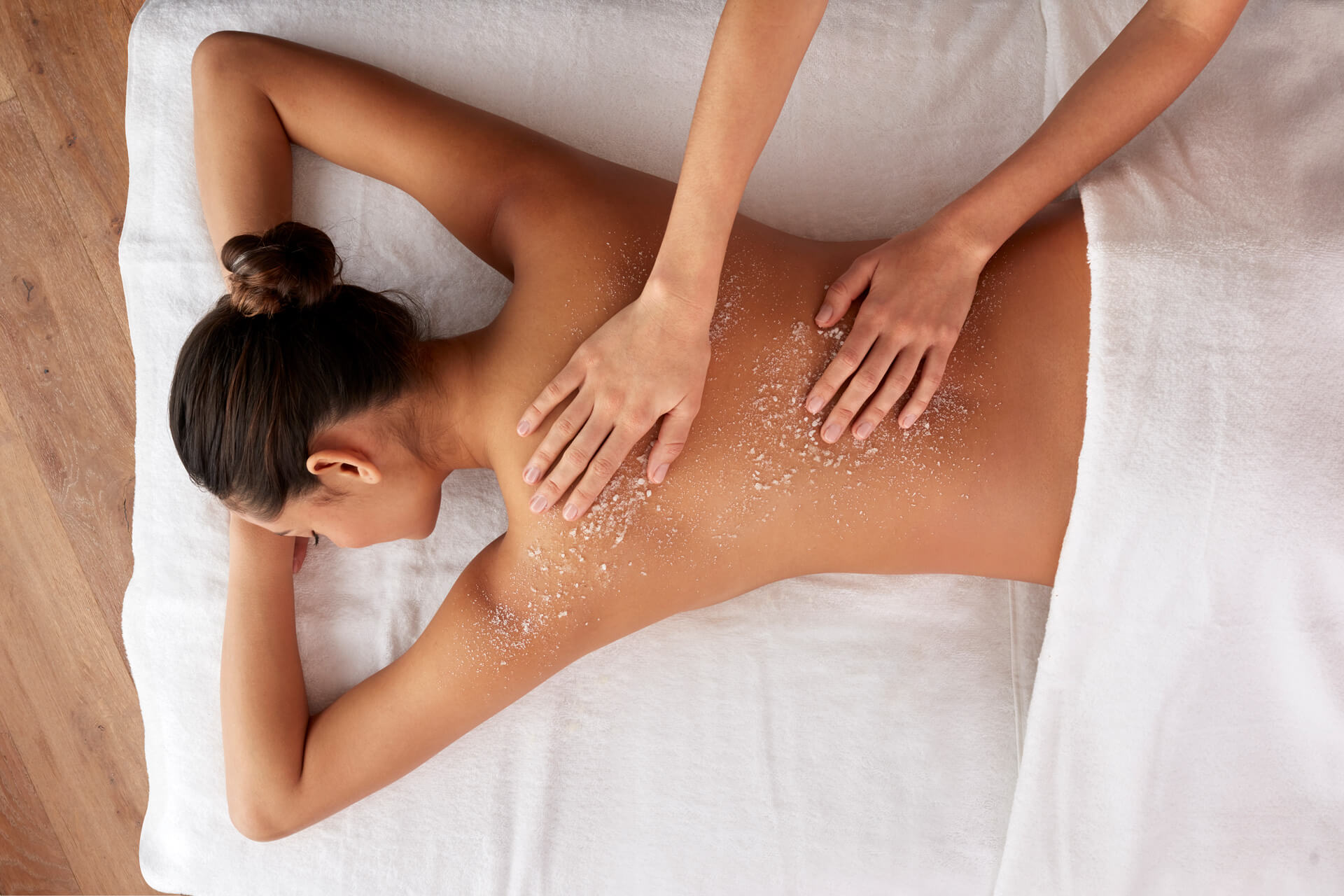 Close up of woman getting a back massage at a spa